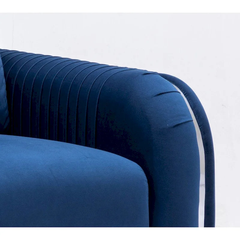 Fauteuil de salon capitonné en velours bleu de style moderne
